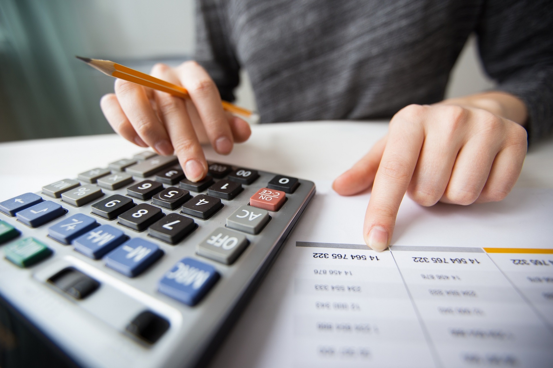 Person dealing with transcription rates and cost calculator