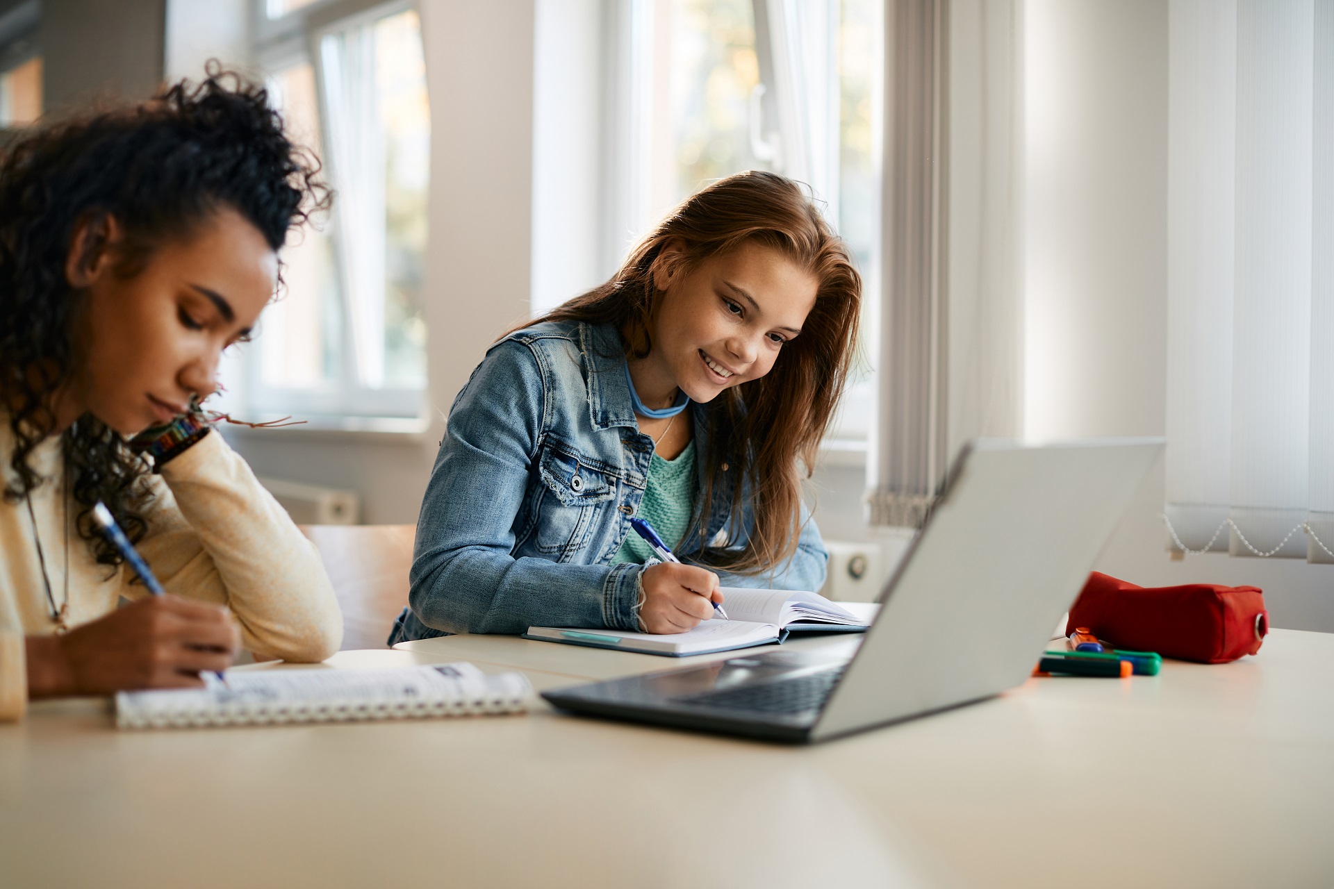 Students with laptop learning from video with academic transcriptions